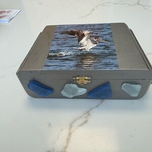 Gray Box with Pelican Design and Blue Accents
